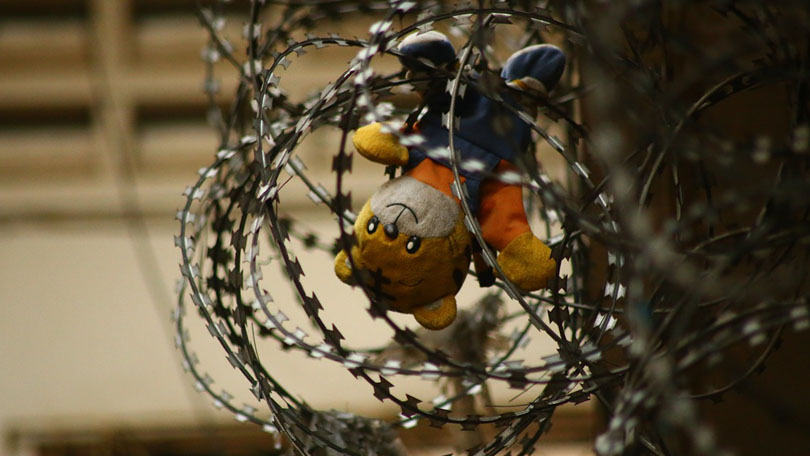 Toy in wire representing ACEs and juvenile justice