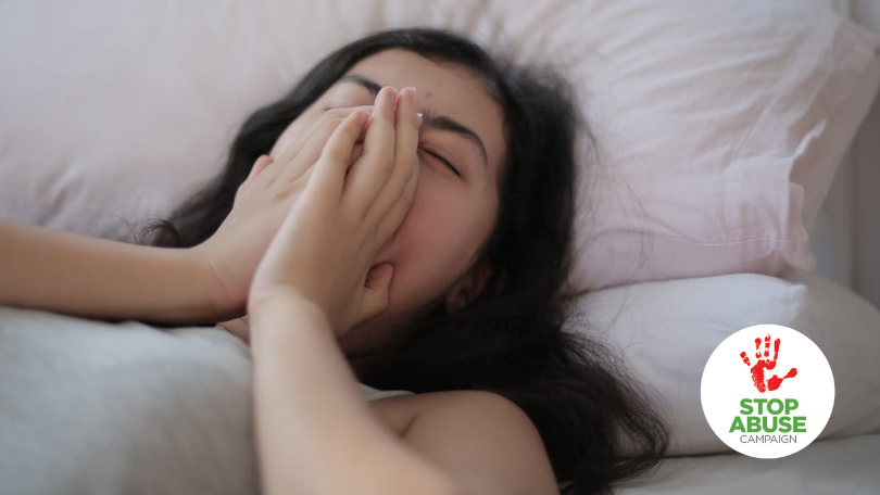 A photo of a neglected child, a girl coughing in her bed with no one to hear, indicating an article on physical neglect in childhood.