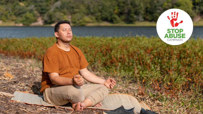 A photo of a man meditating in nature, indicating an article on meditation as part of mental health awareness month series of blogs..
